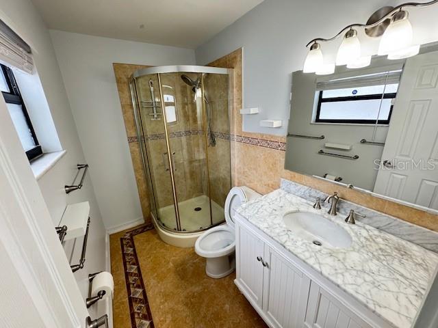413 Citadel Drive Altamonte Springs, FL 32714 - Photo 19 of 47 a bathroom with a granite countertop sink toilet and shower