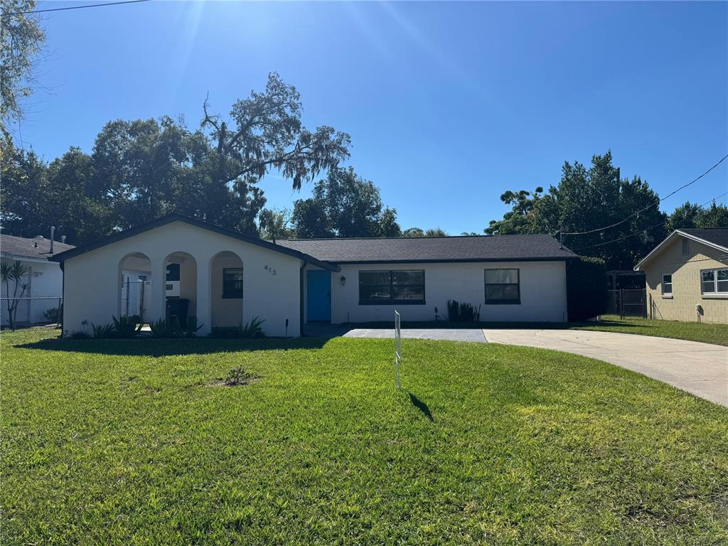 413 Citadel Drive Altamonte Springs, FL 32714 - Photo 38 of 47 a front view of house with yard and trees in the background