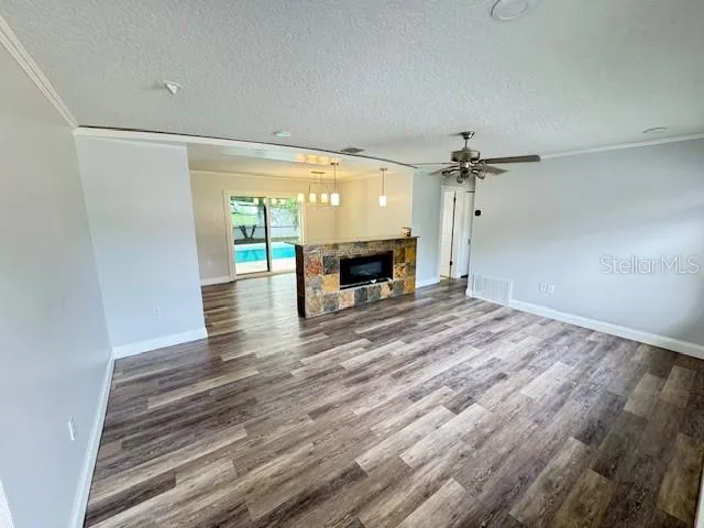 a spacious bathroom with a granite countertop sink and a shower