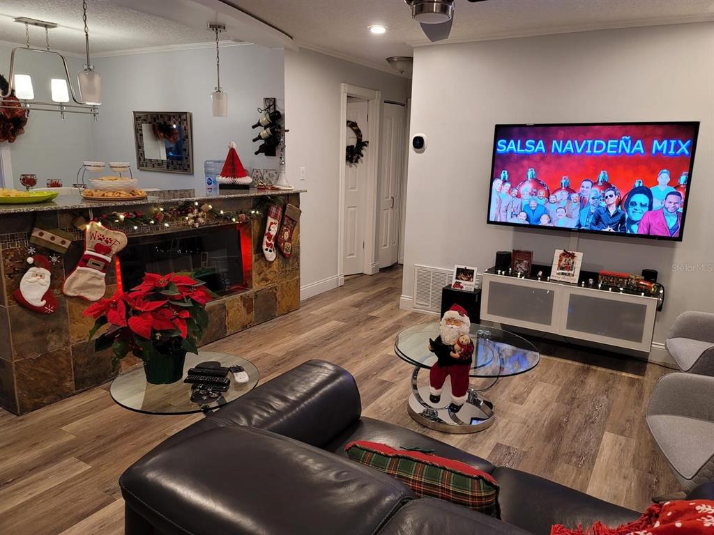 413 Citadel Drive Altamonte Springs, FL 32714 - Photo 42 of 47 a living room with furniture gym equipment and a flat screen tv