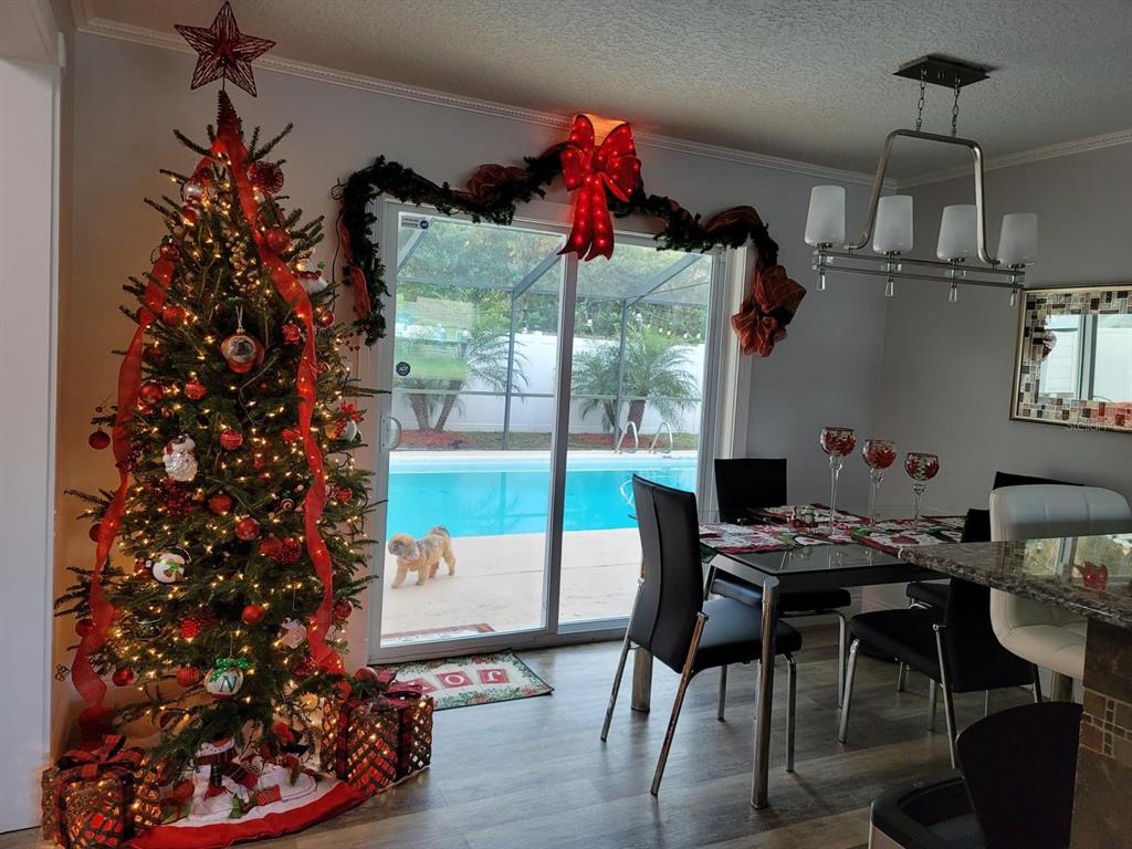 413 Citadel Drive Altamonte Springs, FL 32714 - Photo 43 of 47 a view of a dining room with furniture window and wooden floor