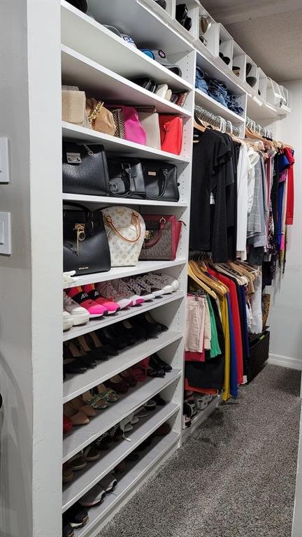 413 Citadel Drive Altamonte Springs, FL 32714 - Photo 46 of 47 a view of walk in closet with clothes and shoes