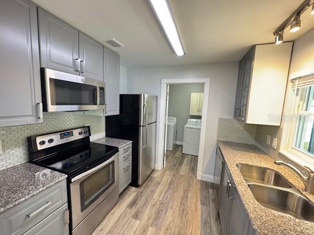 413 Citadel Drive Altamonte Springs, FL 32714 - Photo 8 of 47 a kitchen with a refrigerator stove and sink