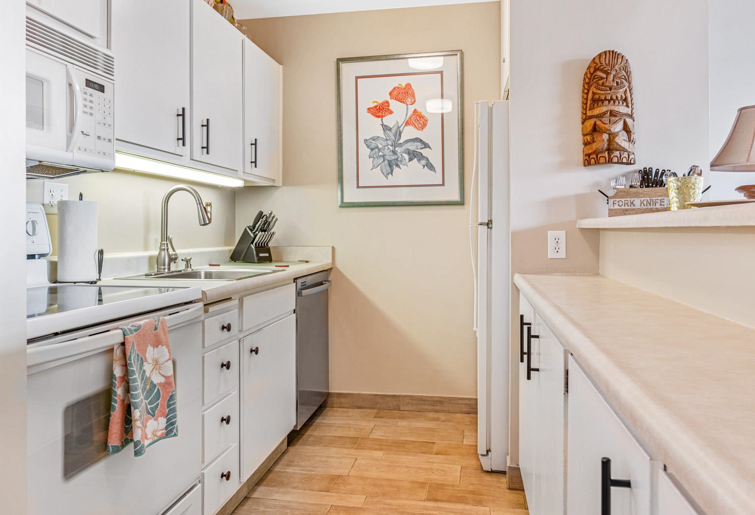 145 North Kihei Road, Unit PH5 Kihei, HI 96753 - Photo 15 of 26 a kitchen with sink cabinets and stove