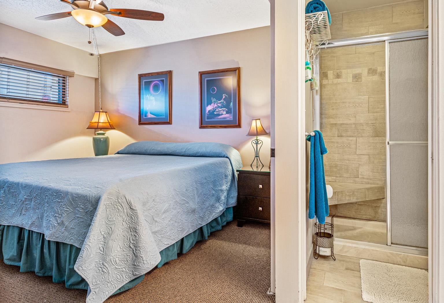 145 North Kihei Road, Unit PH5 Kihei, HI 96753 - Photo 19 of 26 a bedroom with a bed and a chandelier