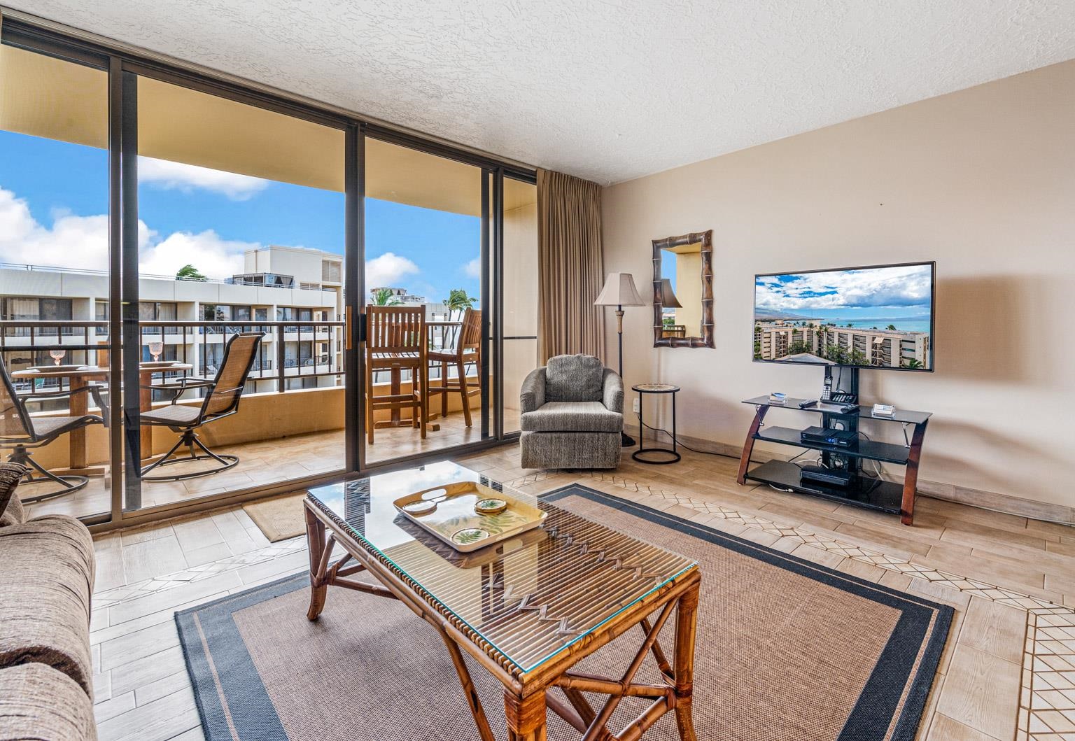 145 North Kihei Road, Unit PH5 Kihei, HI 96753 - Photo 6 of 26 a living room with furniture and a floor to ceiling window