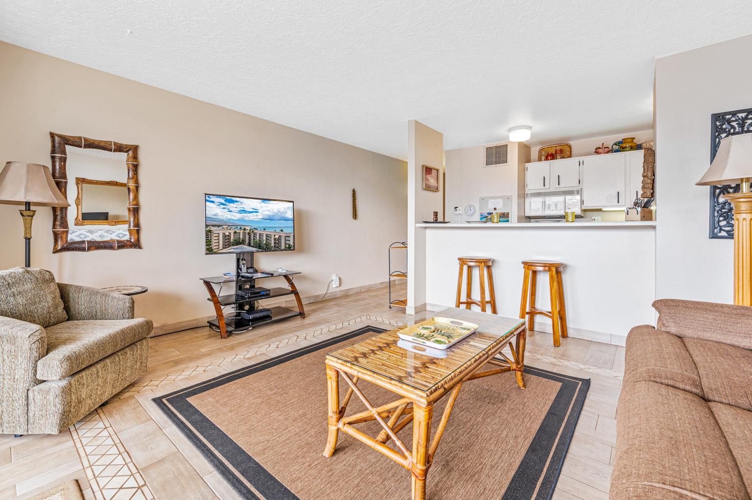 145 North Kihei Road, Unit PH5 Kihei, HI 96753 - Photo 8 of 26 a living room with furniture and a table