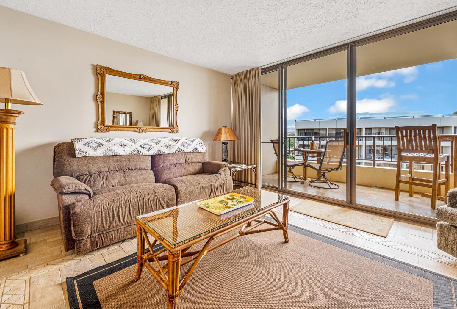 145 North Kihei Road, Unit PH5 Kihei, HI 96753 - Photo 10 of 26 a living room with furniture and a floor to ceiling window