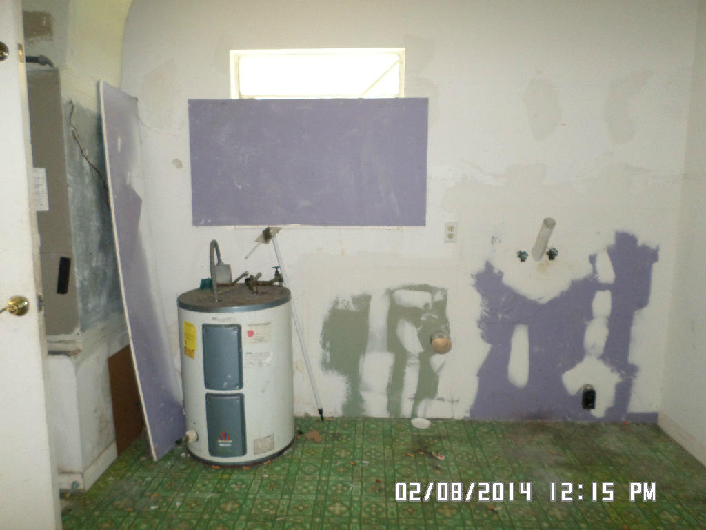 5310 Seagrape Drive Fort Pierce, FL 34982 - Photo 11 of 15 Laundry area in garage