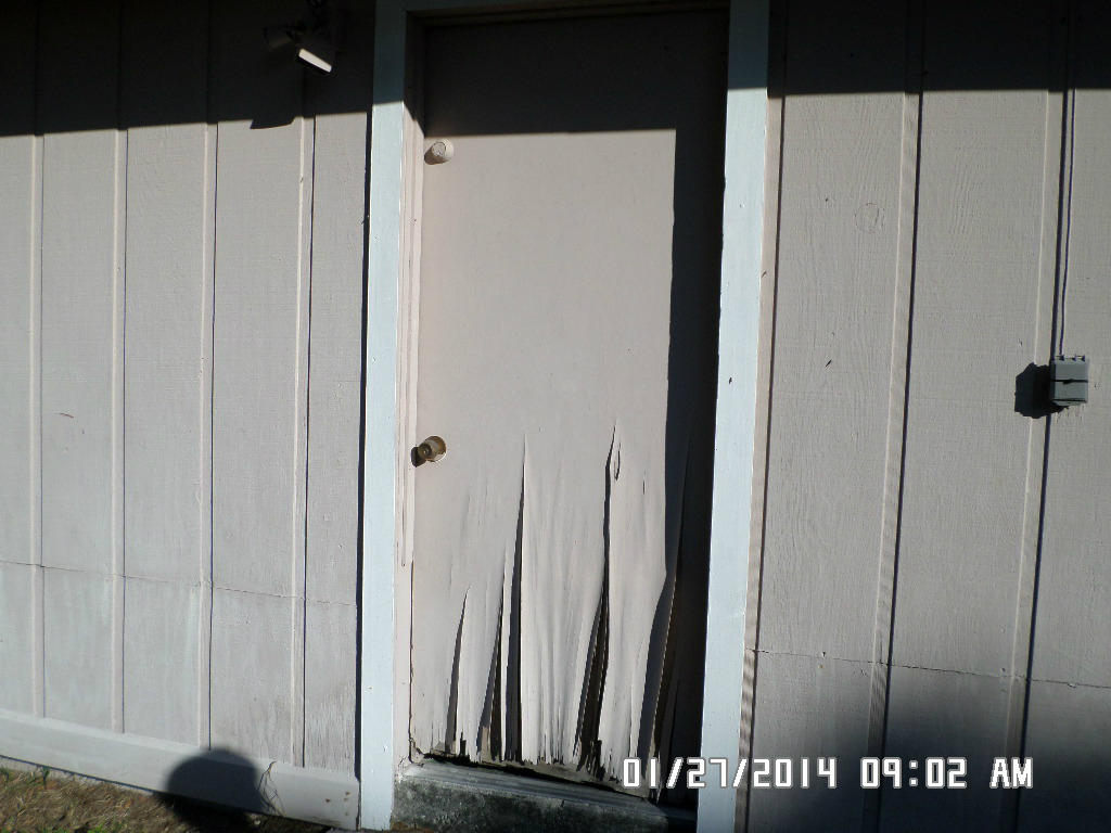 5310 Seagrape Drive Fort Pierce, FL 34982 - Photo 14 of 15 Side garage door