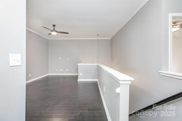 a view of an empty room with windows