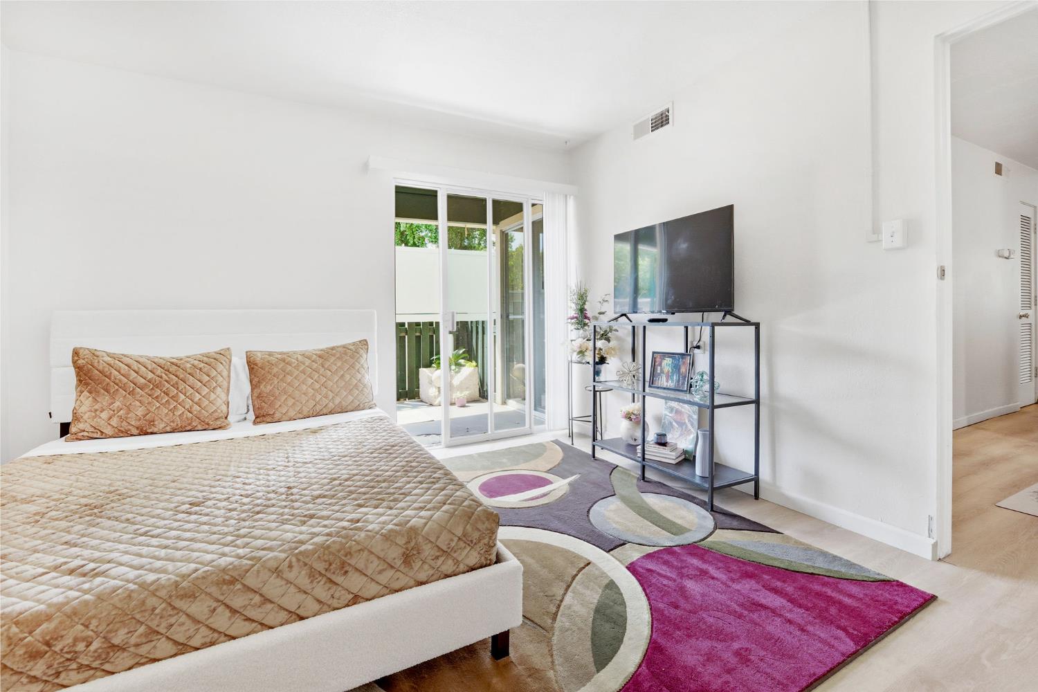 240 2nd Street Davis, CA 95616 - Photo 25 of 56 a bedroom with a bed and a flat screen tv