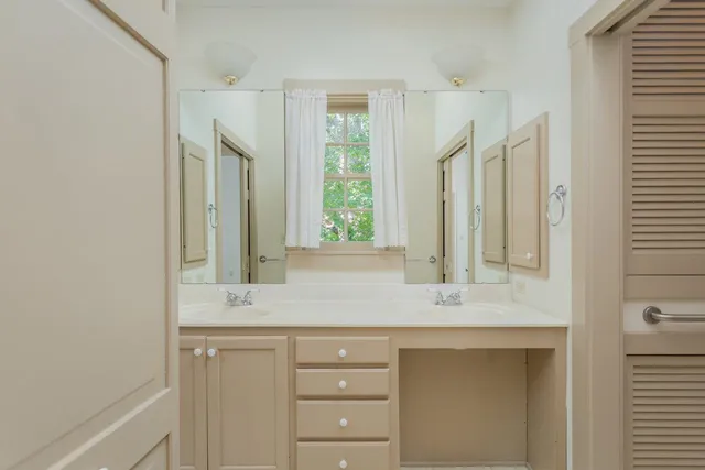 a bathroom with a toilet and a tub
