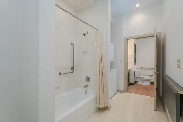 a bathroom with a double vanity sink and mirror
