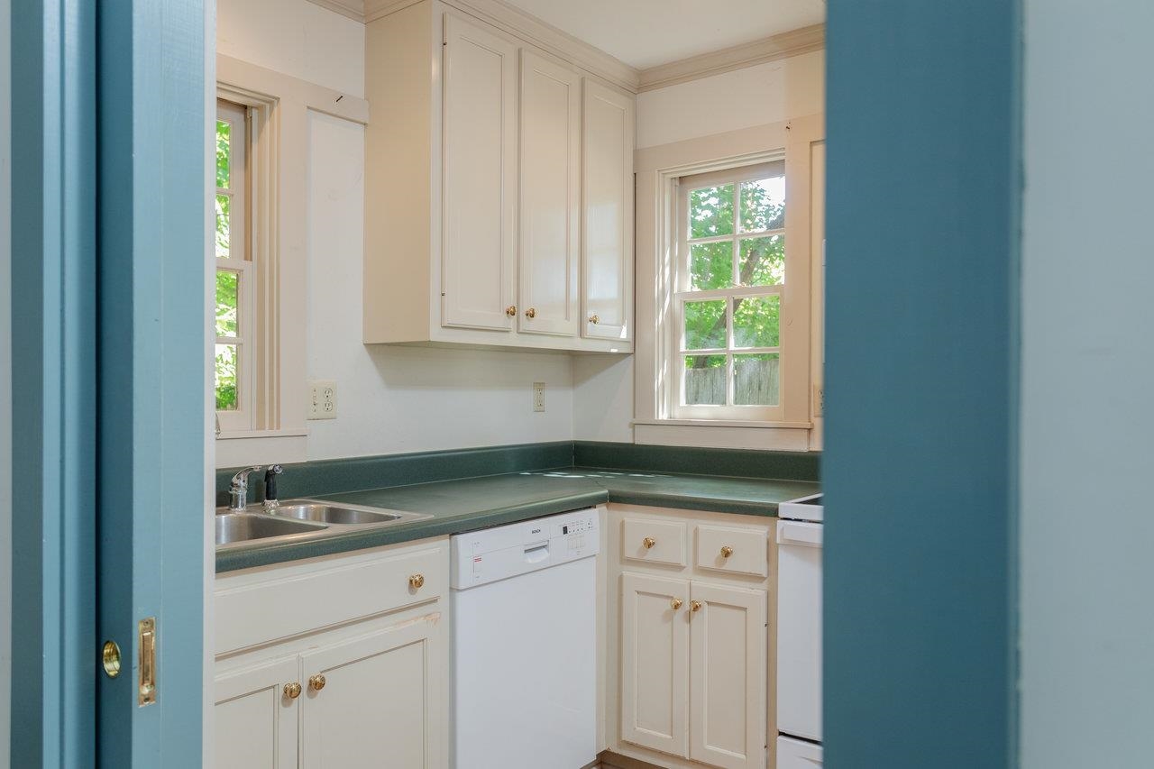 145 Fort Defiance Road Fort Defiance, VA 24437 - Photo 15 of 70 a kitchen with granite countertop white cabinets and a window