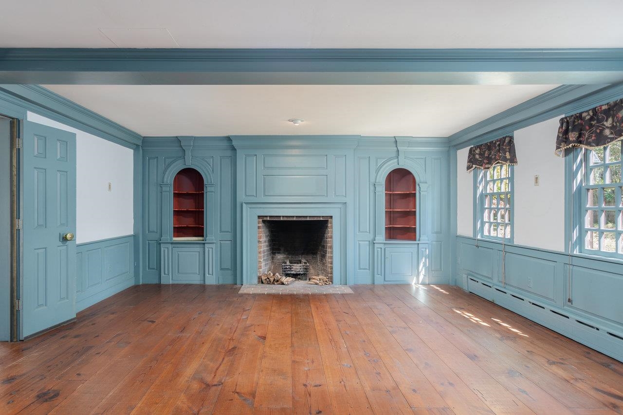 145 Fort Defiance Road Fort Defiance, VA 24437 - Photo 22 of 70 a view of a hallway with wooden floor and a fireplace