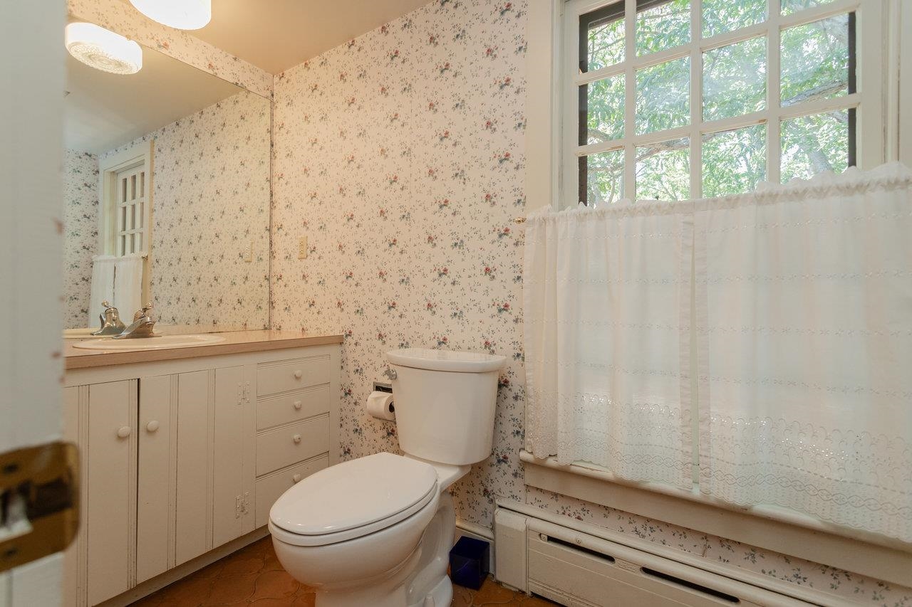 145 Fort Defiance Road Fort Defiance, VA 24437 - Photo 37 of 70 a bathroom with a granite countertop toilet a sink and a shower