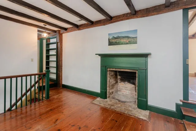 a view of a house with a large tree