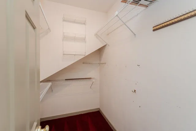 an aerial view of a residential houses with outdoor space and swimming pool
