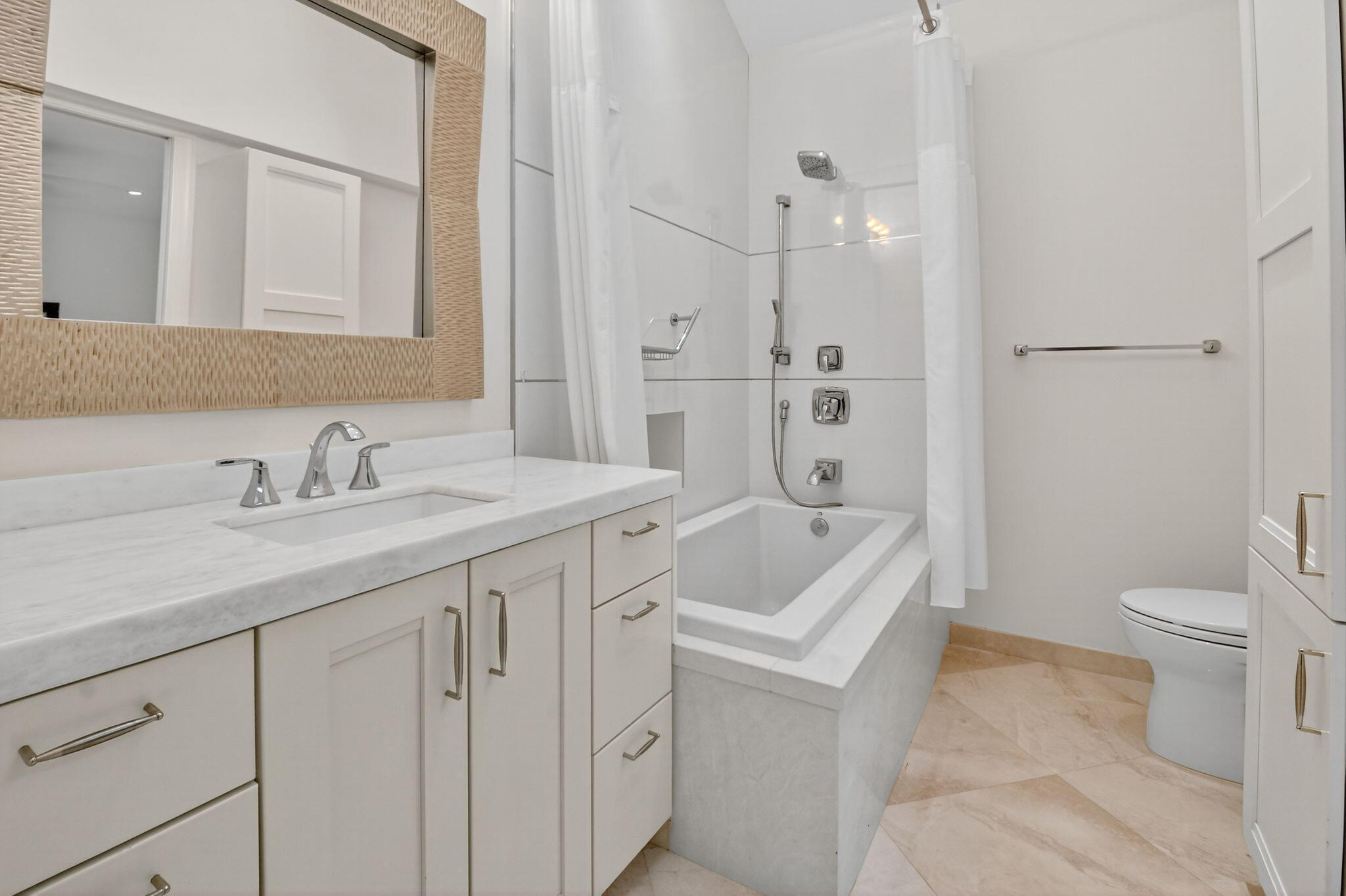 2563 Northwest 63rd Street Boca Raton, FL 33496 - Photo 38 of 65 a bathroom with a granite countertop sink a toilet and a bathtub