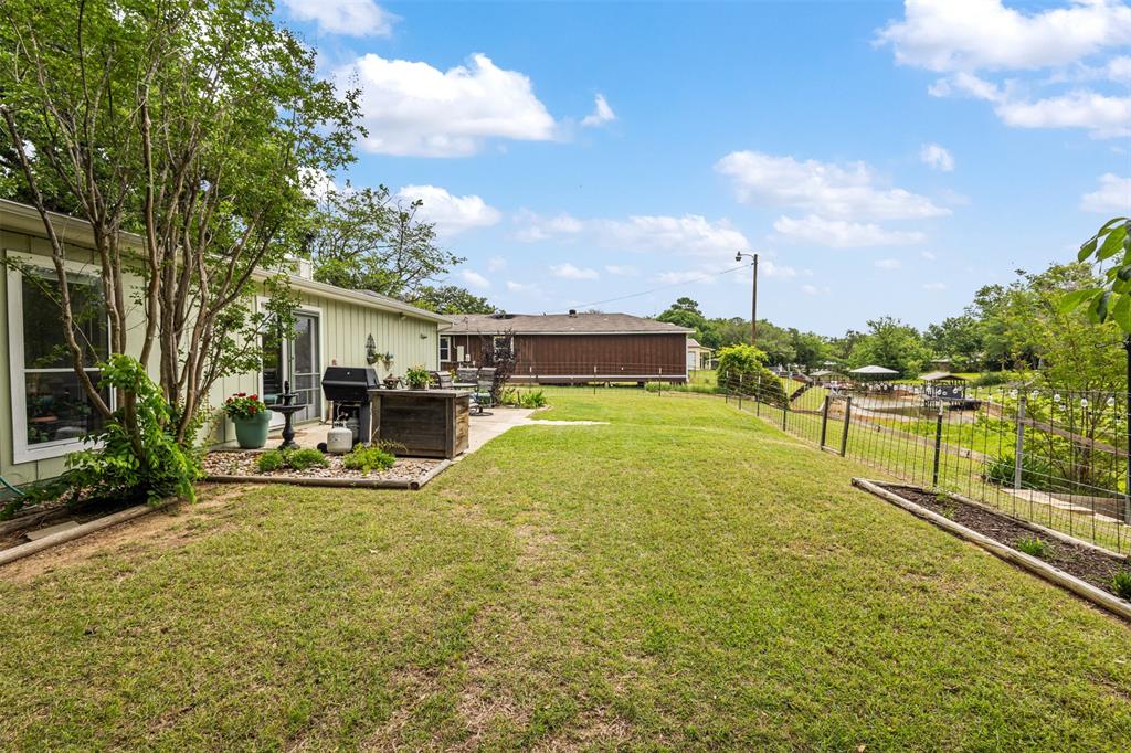 713 Midway Road Tool, TX 75143 - Photo 26 of 28 a view of a swimming pool with a patio