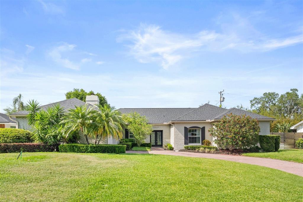 a front view of house with yard and green space