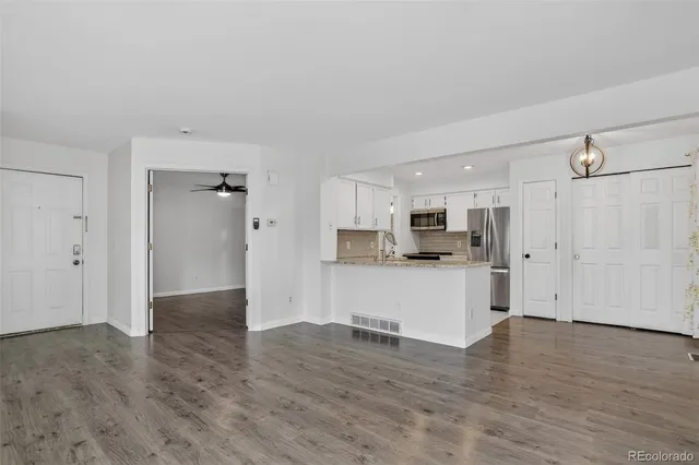 a view of kitchen with wooden floor
