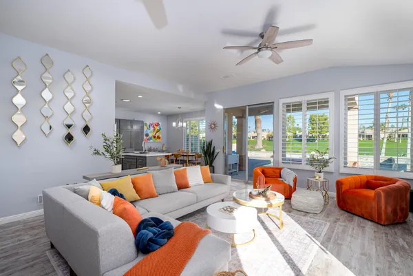 a living room with furniture and a large window