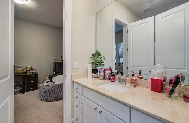 a bathroom with a sink and a mirror