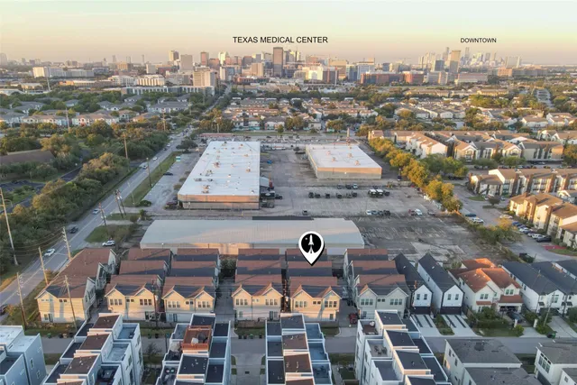 an aerial view of a city with lots of residential buildings
