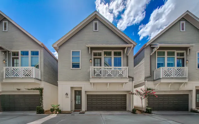 a front view of a house with garage