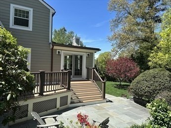 45 Wellesley Road Belmont, MA 02478 - Photo 33 of 39 a view of a patio with two chairs and a table with potted plants