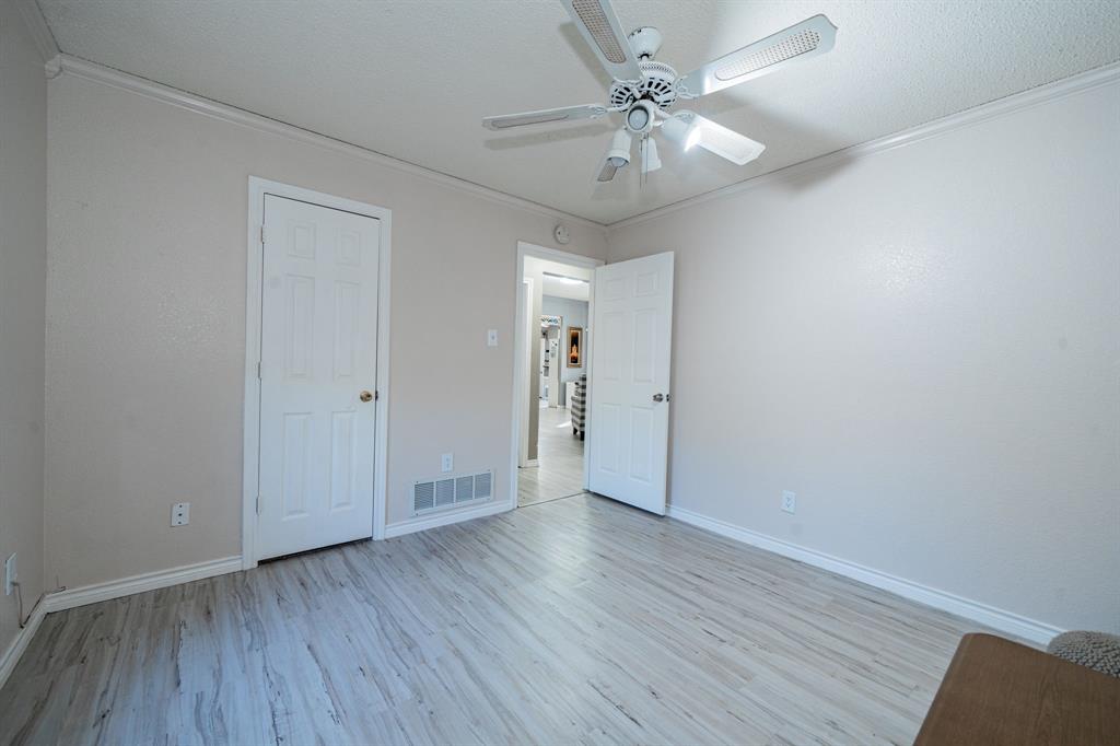 508 Tishomingo Road Waxahachie, TX 75165 - Photo 20 of 26 a view of an empty room with wooden floor
