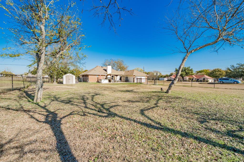 508 Tishomingo Road Waxahachie, TX 75165 - Photo 23 of 26 a view of dirt yard with a table and chair