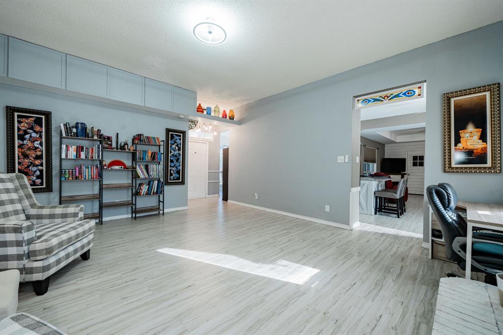 508 Tishomingo Road Waxahachie, TX 75165 - Photo 4 of 26 a view of a livingroom with furniture and gym equipment