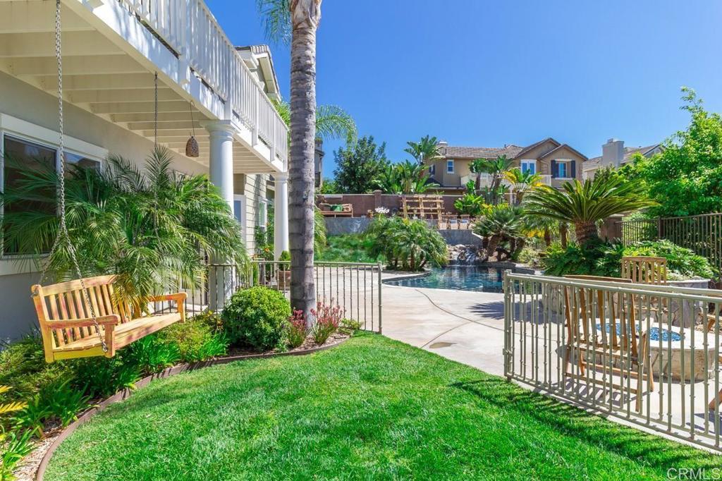 1499 Paseo De Las Flores Encinitas, CA 92024 - Photo 11 of 30 a view of a house with a yard and plants