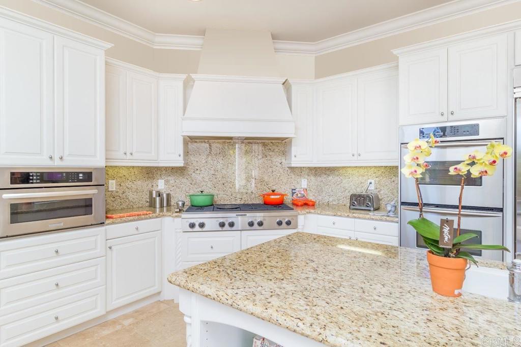 1499 Paseo De Las Flores Encinitas, CA 92024 - Photo 14 of 30 a kitchen with a window a sink and cabinets