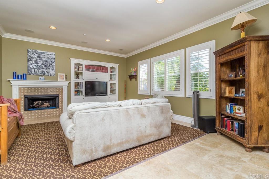 1499 Paseo De Las Flores Encinitas, CA 92024 - Photo 18 of 30 a living room with furniture and a fireplace