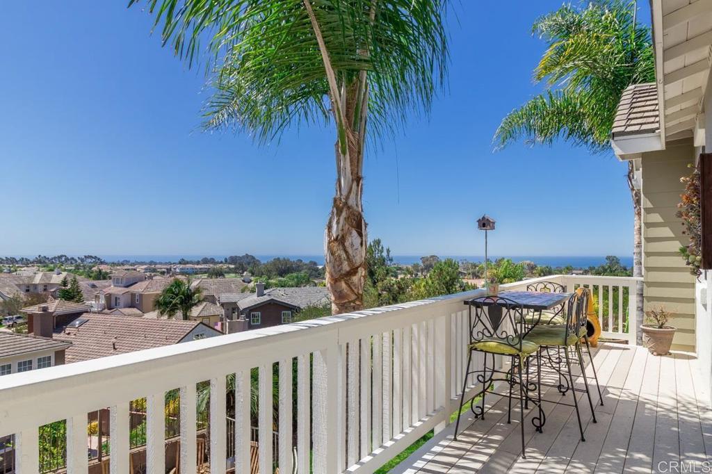 1499 Paseo De Las Flores Encinitas, CA 92024 - Photo 21 of 30 a view of a chairs and table in patio with potted plants