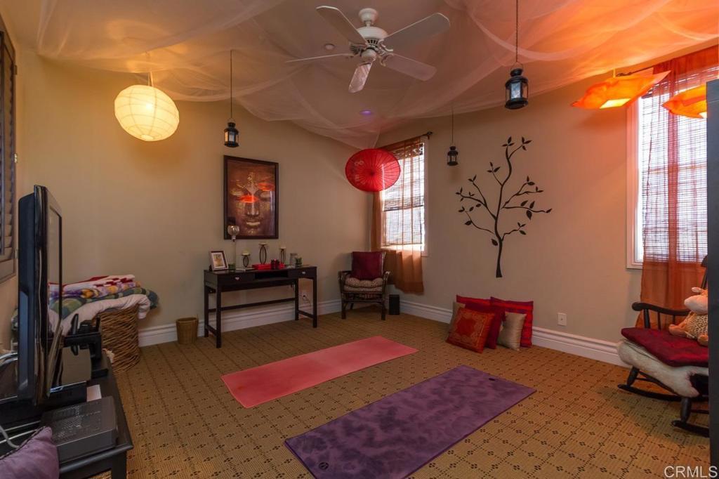 1499 Paseo De Las Flores Encinitas, CA 92024 - Photo 26 of 30 a living room with furniture rug and a window