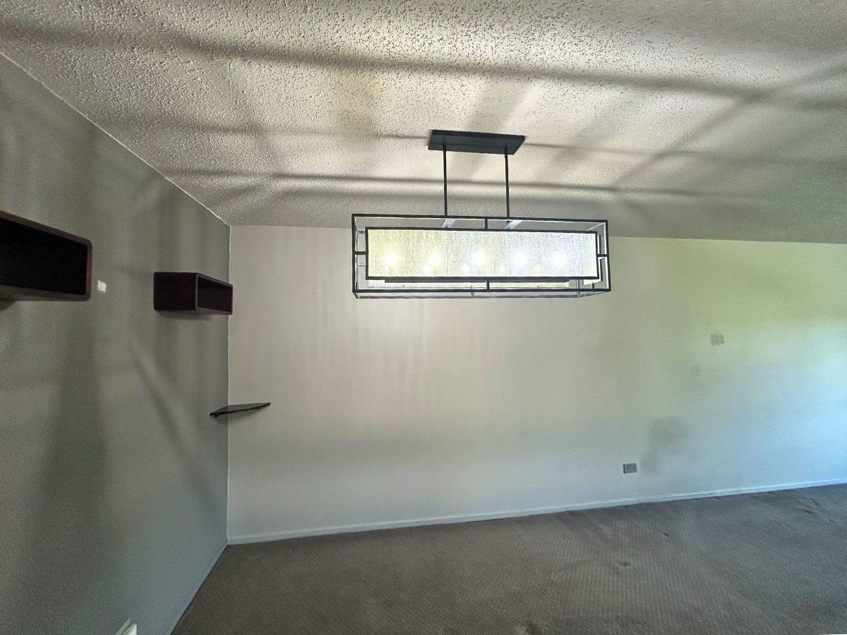 1206 New Wilke Road, Unit 206 Arlington Heights, IL 60005 - Photo 7 of 17 a view of a room with a refrigerator and a window