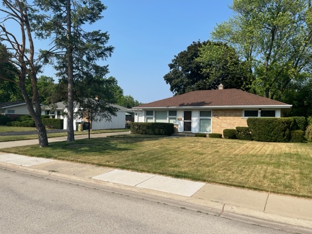 1027 Whitfield Road Northbrook, IL 60062 - Photo 1 of 21 front view of a house with a yard