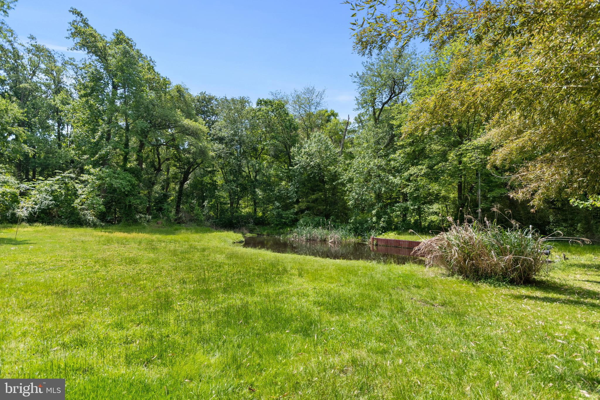 560 Church Road Sewell, NJ 08080 - Photo 9 of 38 Pond with irrigation pump for inground sprinkler s