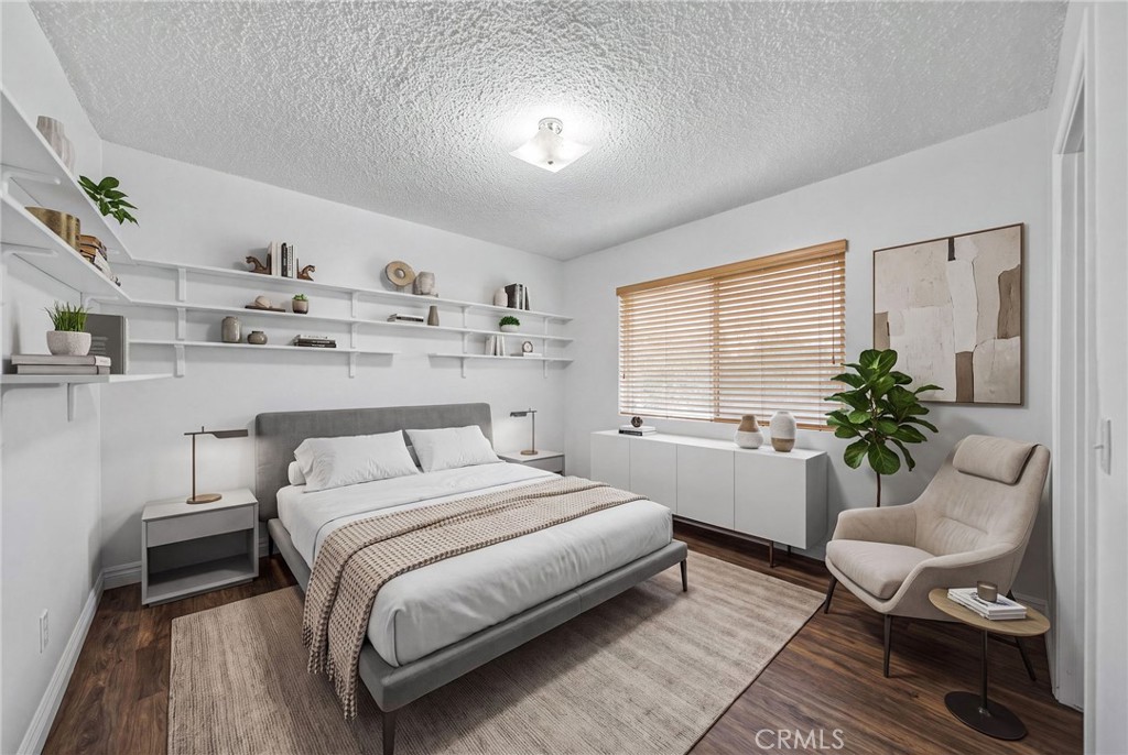 29078 Bradley Road Menifee, CA 92586 - Photo 30 of 42 a bed room with a bed and a couch