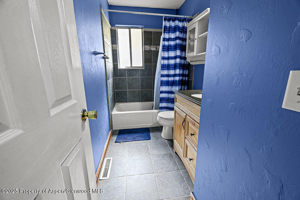 1159 Barclay Street Craig, CO 81625 - Photo 22 of 45 a bathroom with a bathtub and a shower