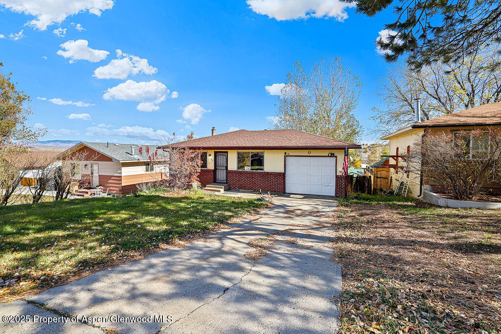 1159 Barclay Street Craig, CO 81625 - Photo 3 of 45 a front view of a house with garden