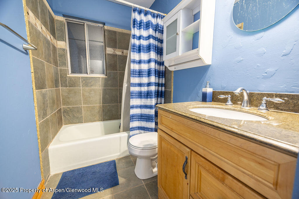 1159 Barclay Street Craig, CO 81625 - Photo 31 of 45 a bathroom with a sink a toilet and shower