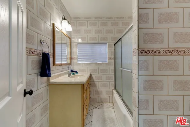 a bathroom with a sink and shower