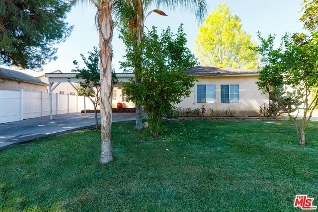 a house view with a garden space