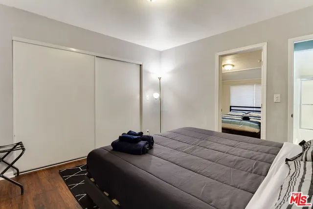 a room with a bed and a mirror